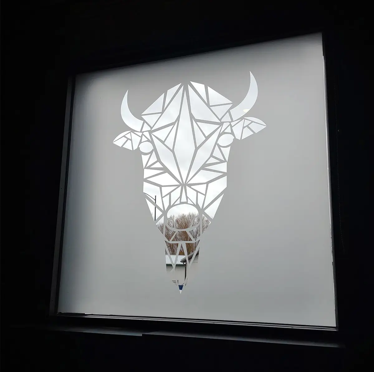 Custom frost bison head stencil die-cut on commercial window